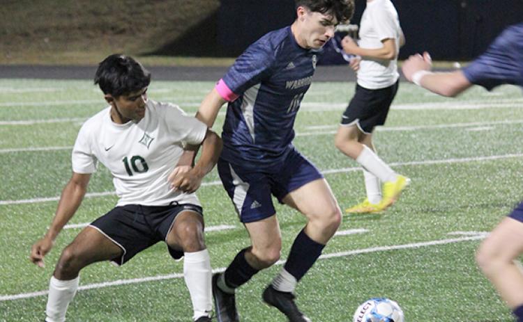 Preskitt Castleberry, right, scored the game-winning goal late in the second overtime period in the Warrios' 1-0 win over Pickens.  (Photo/Mark Turner)