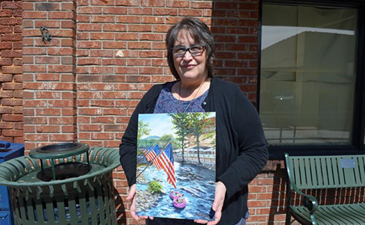 Rebecca Carfizzi’s painting, “Fourth of July in Helen” won this year’s Scoop cover contest. (Photo/Samantha Sinclair)