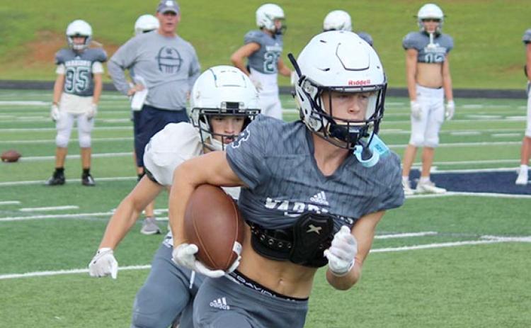 Gaines Clark heads down the field after catching a pass in a recent practice. (Photo/Mark Turner)