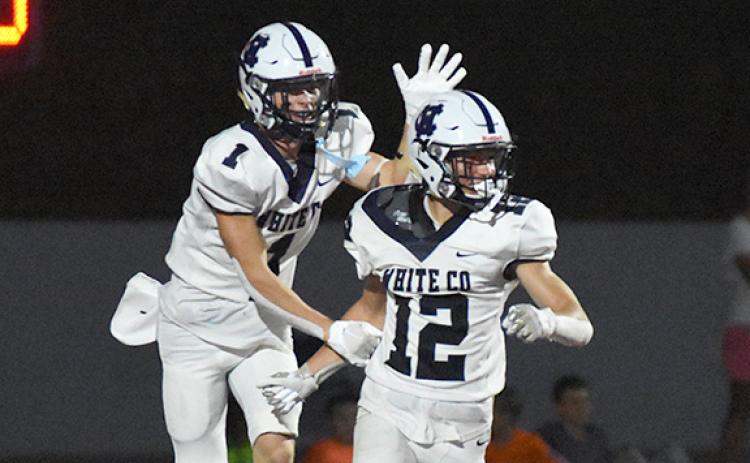 Zach Godfrey, right, celebrates with Gaines Clark after Godfrey picked off a pass and went 43 yards for a touchdown in the third quarter.  (Photo/Basil Ray)
