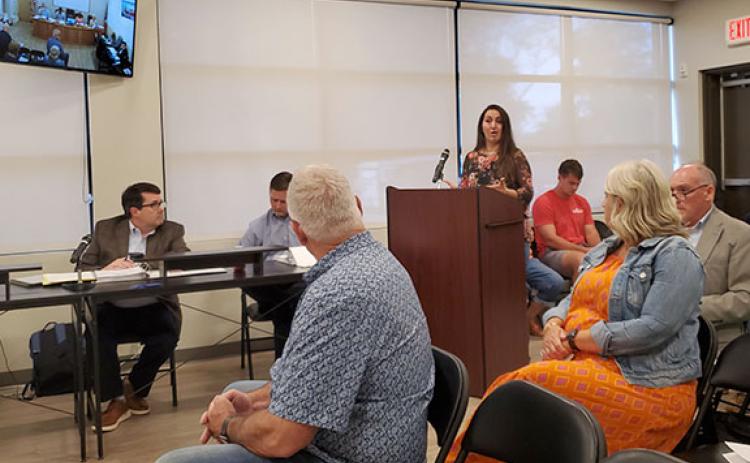 Andrea Evans shares her concerns about the added the traffic on West Jarrard Street as developer Tom Williams listens. (Photo/Samantha Sinclair)