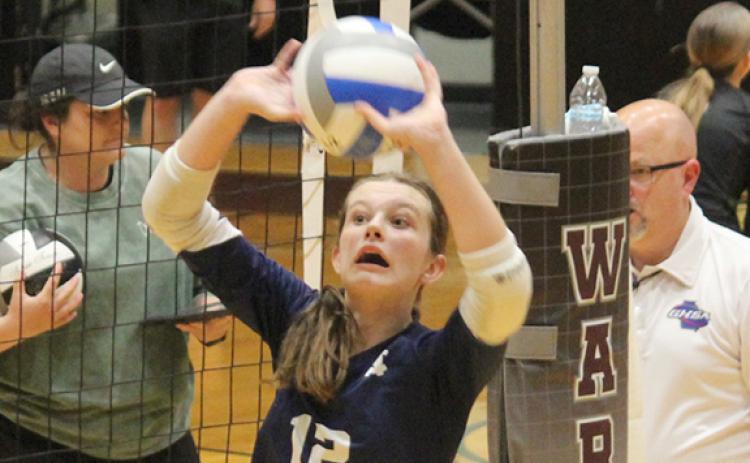 Kalynn Watkins sets a pass during the Area 6-AAA finals last week in Gainesville. (Photo/Mark Turner)