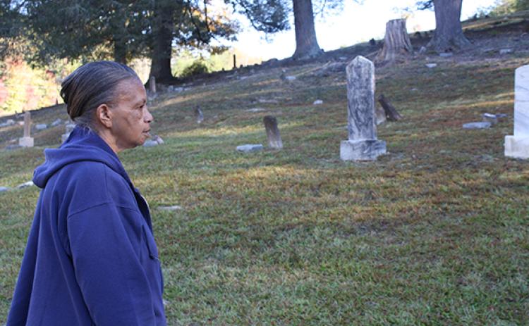 Andy Allen takes it all in, admiring the restored graves in Bean Creek Cemetery. (Photo/Eric Tiongson)