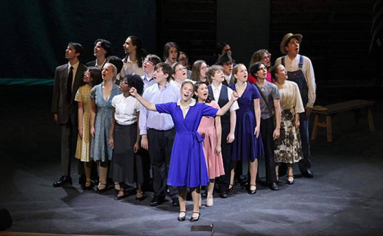 Sarah Wilkinson (front, blue dress) performs the song “If You Knew My Story” at the beginning of the ‘Bright Star’ theater play with the entire cast. Wilkinson plays the main character, Alice Murphy. (Photo/Hannah Caudell)
