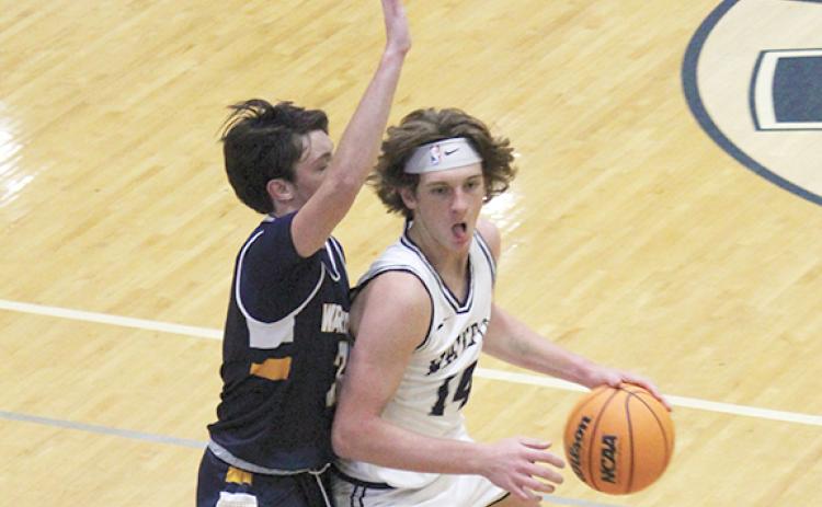 Blayne Gunter drives past a Horizon defender during Tuesday's game in Cleveland. (Photo/Mark Turner)