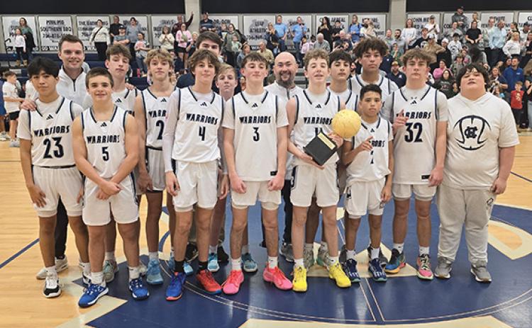 The White County Middle School basketball teams  picked up a pair of North Georgia Mountain League championships last week during the post-season tournament on the WCMS campus. The Warriors' eighth-grade squad posted a 51-40 victory over Union County to earn the league title.  (Photo/Mark Turner)