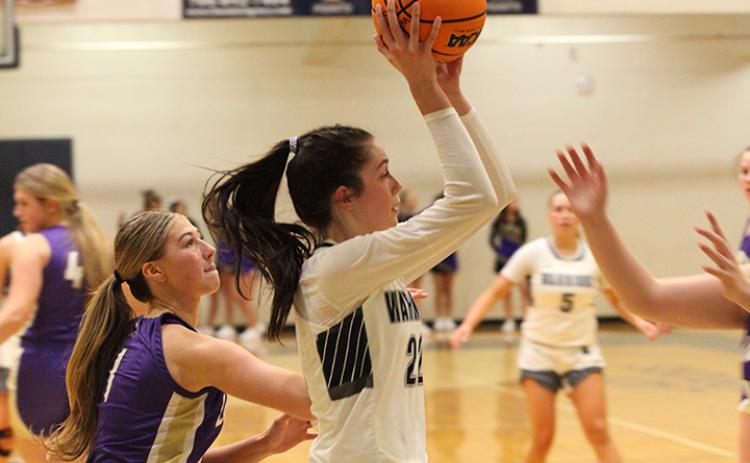 Kylie Watkins drives past Lumpkin County's Maddie Lee during the region game last Thursday in Cleveland
