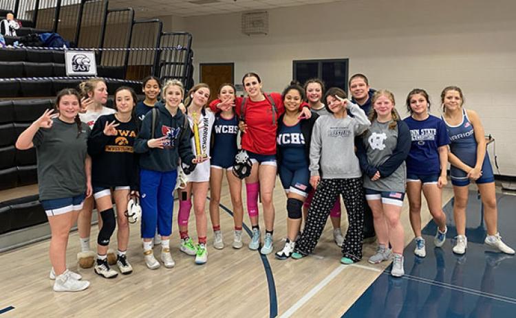 The WCHS girl's wrestling team finished third in Area 8 tournament last week at East Jackson County High School in Commerce. This was the girl's team first-ever appearance in area duals event. Members of the team are from left, Annabelle Thomas, Marley Mather, Ava Abercrombie, Omiknee Nicely, Ollie Weiland, Kenzie Addis, Bailey Roberts, Zella Weiland, Jennifer Garcia, Bayle Herbert, Priscilla Vazquez, WCHS head coach Patrick Lowendick, Riley Pitts, Vivika Vazquez and Nylee Martin (Photo/WCHS Wrestling)