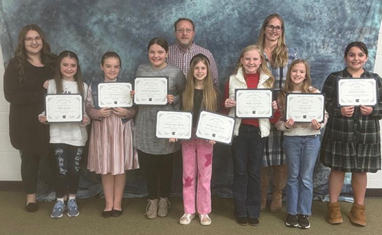 The White County Board of Education honored Mossy Creek Elementary School students who received awards during the BETA state convention in Savannah back in December. Pictured above (front row from left to right): Collins Jackson, Nora Hampton, Jooniper Montgomery, Marley Martin, Kaitley Davidson, Gwen Nash and Bethany Sanders. Back row from left to right: Kaitlin Dunn, Marc Dunn, and Jana Gossett. (Photo/Patrick Fargason)