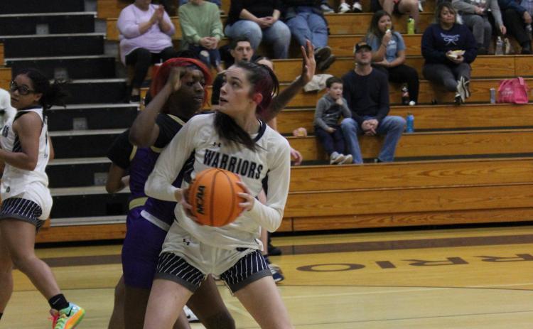 Kylie Watkins works against a Bainbridge defender during the state state playoff game. (Photo/Mark Turner)