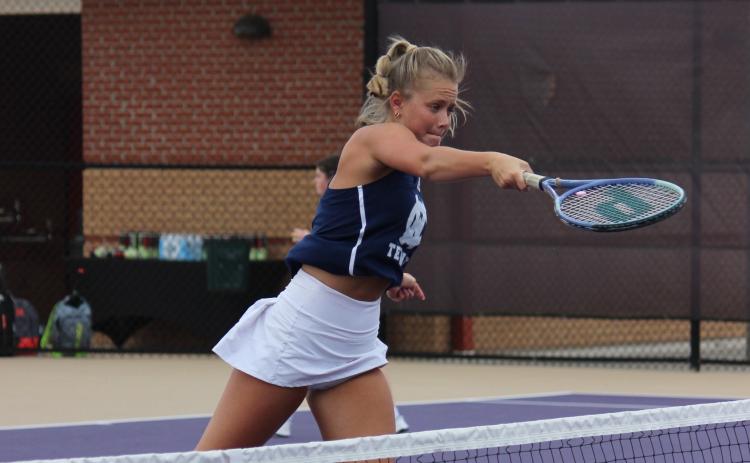 Sarah Jarrard finishes off a slam t the net during the Lady Warriors' win over Lumpkin County Tuesday morning at the 6-AAA tournament in Dahlonega. (Photo/Mark  Turner)