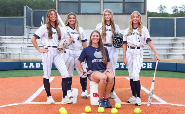 New head coach Cari Barrett, seated, and seniors, from left, Tyla Nix, Logan Fain, Cierra Bailey and Maddie Kate Hall  host Forsyth Central Aug. 5 in the season opener.  MARK TURNER /WCN