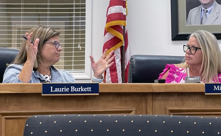 Superintendent Laurie Burkett makes her point with School Board Chair Missy Jarrard. JERRY GRILLO/WCN