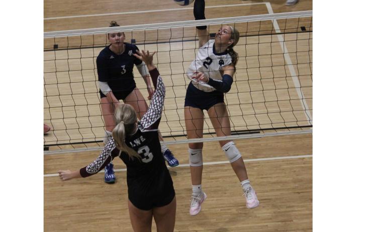 Daylee Barrett hammers a kill during the win over Chestatee in the opening round game of the 6-AAA tournament Tuesday at North Hall. MARK TURNER/WCN