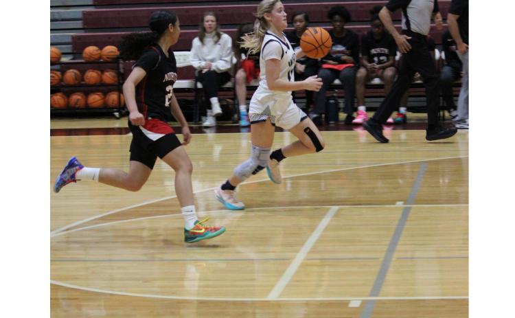 Jossleyn Burke heads to the basket during the Lady Warriors' win over North Gwinnett last Saturday at the 400 Showdown at Dawson County High School. MARK TURNER/WCN