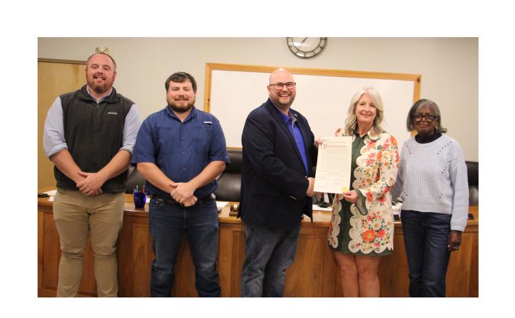 From left, council member CJ McDonald, council member Jeremy McClure, Mayor Josh Turner, White County Chamber of Commerce President Beth Truelove and council member Annie Sutton present the Farm-City Week Proclamation. CARLY HENDERSON/WCN