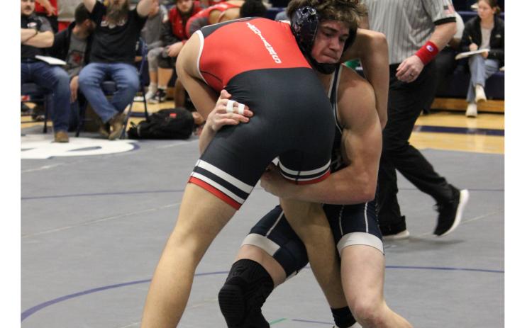 Josh Lane picks up a Stephens County wrestler during the Warriors' win over the Indians on Senior Night. MARK TURNER/WCN.