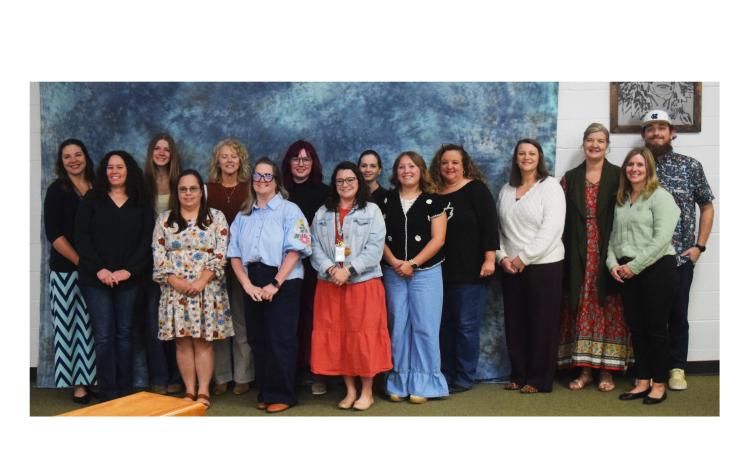 Paraprofessionals in a teacher apprenticeship program, along with their teacher mentors, are recognized during the Nov. 20 school board meeting. DENISE ETHERIDGE/WCN