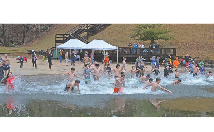 Winter Bear Plunge participants greet a new year during the 2025 Winter Bear Plunge at Unicoi State Park’s beach. FILE PHOTO