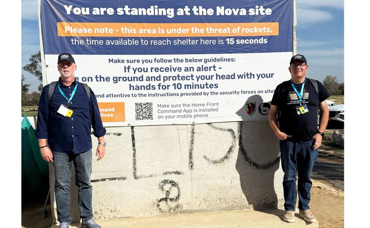 Pastor David Sansot, left, and Pastor Avery Hutto of The Bridge Church in Cleveland stand at the Nova site in southern Israel, where Hamas operatives attacked on Oct. 7, 2023. See more Summit photos on page 6A. SUBMITTED PHOTO