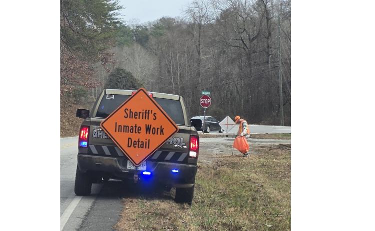 Inmates pick up trash along a county road. SUBMITTED PHOTO