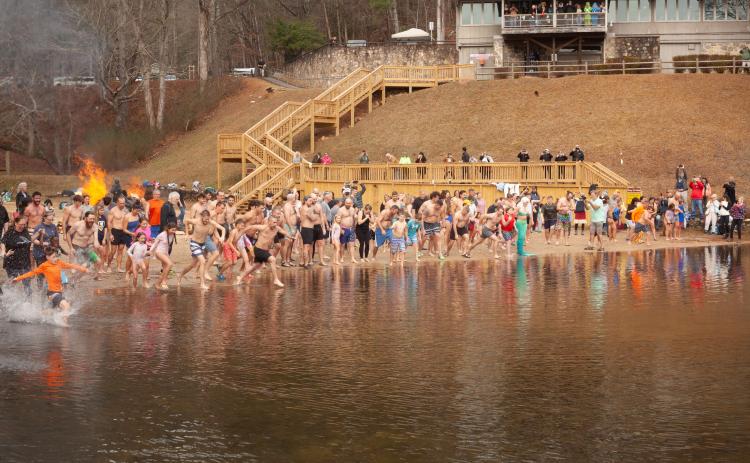 Hundreds of people rush into the water for the Winter Bear Plunge at Unicoi State Park on Jan. 3. PHOTO COURTESY OF JESSI TAYLOR/UNICOI STATE PARK