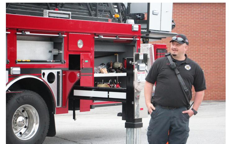 Lt. Jason Reed of the Helen Fire Department explains the ins and outs of the department’s new fire truck to students at Mountain Education’s White Campus. CARLY HENDERSON/WCN