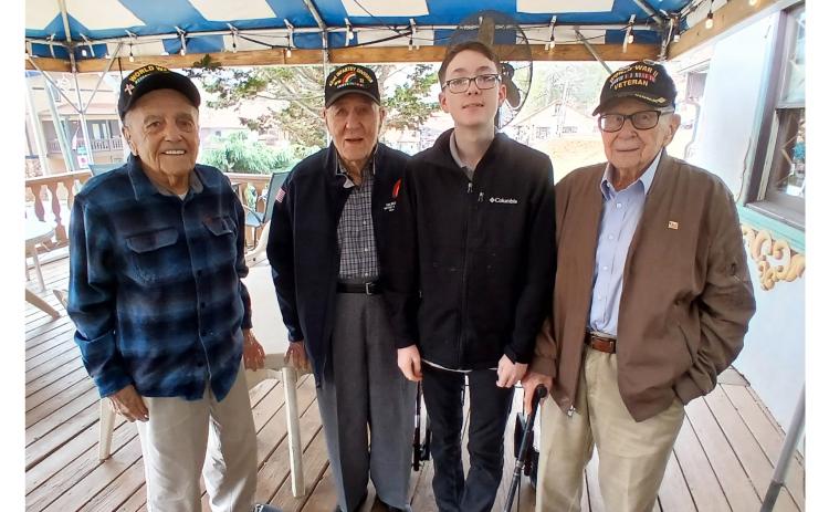 From left, Andy Negra, Hilbert “Hibby” Margol, Caleb Schneider and Alan Kinder gather following lunch. Schneider, 14, raises money for his Lunch with Veterans program through donations through his radio station, G.I. Jive Radio. SUBMITTED PHOTO
