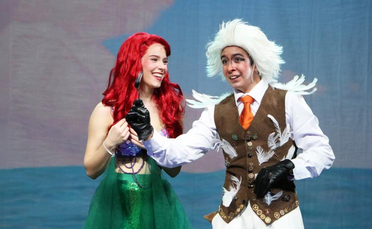 Ariel, left, played by Sarah Wilkinson is delighted with the fork found by Scuttle the seagull, played by Edwin Polangco-Kenney. SUBMITTED PHOTO