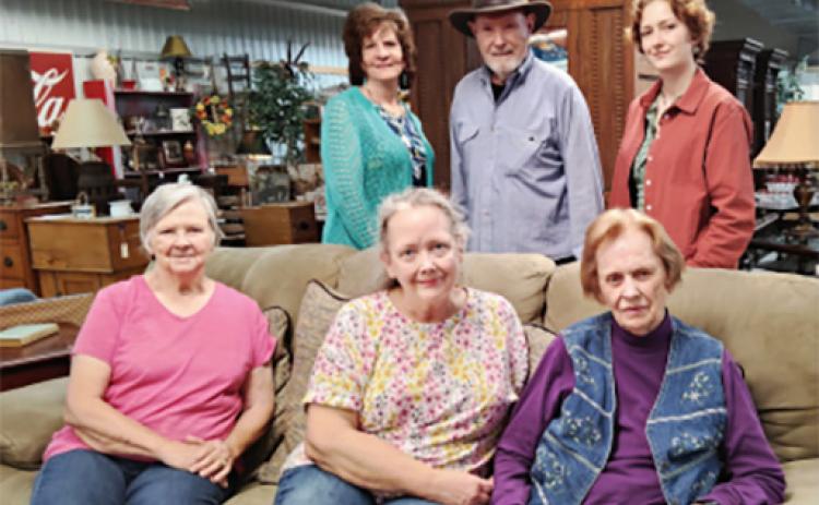 The owner, managers and staff at Mountain Laurel Antique Mall and Furniture Consignment Showroom enjoy greeting customers. Sitting from left: Katie White, Barbara McClure and Dorothy Ralston. Standing from left: Carol Burgess, Bobby Dyer and Ariana McClure. Not pictured: Larry Hall, Lois Boggs and Ed Hawksford. DENISE ETHERIDGE/WCN