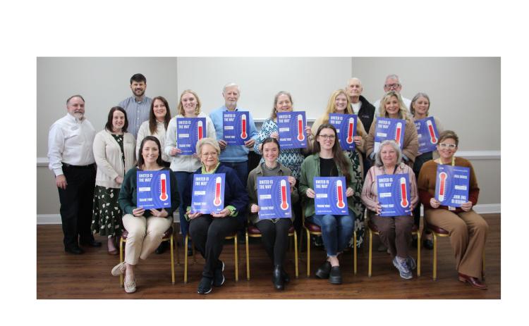 United Way Board Vice Chairman Nathan Eason presented checks to 12 local community agencies at a check distribution ceremony last week. CARLY HENDERSON/WCN