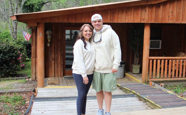 Cody and Jessica Montgomery stand in front of one of five houses at Levi’s Ministries’ newly acquired Jericho House property in Sautee. CARLY HENDERSON/WCN