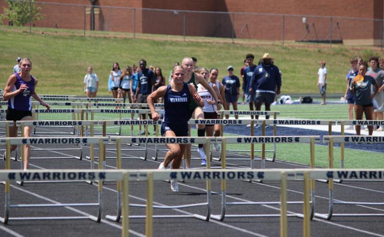 Katana Rickett won the 100-meter hurdles during the final day of the region meet. MARK TURNER/WCN