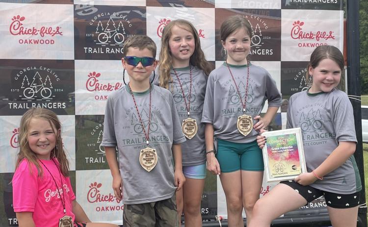Shown on the podium after the final event of the season are, from left, Faith Hogan, Paxton Swanzy, Mercy Hogan, Reagan Phillips and Connect Award Winner Grace Meinecke.