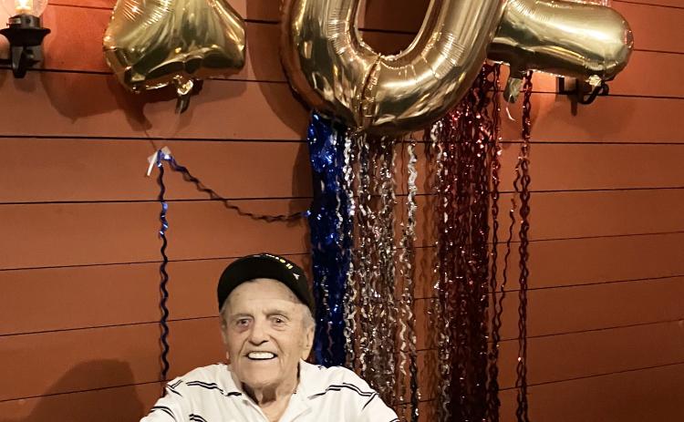 White County resident Andy Negra, 102, grins below his birthday balloons last weekend during a celebratory dinner at Nacoochee Grill. SUBMITTED PHOTOS