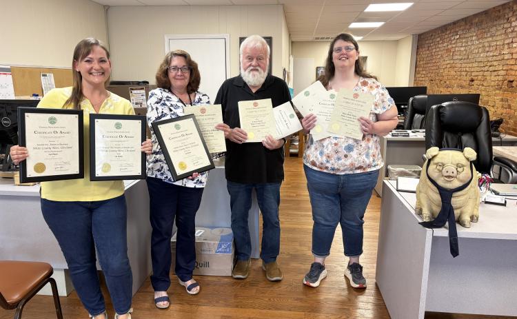 Members of the White County News staff were presented with numerous Georgia Press Association awards earlier this month. From left: General Manager Erin Etris, Managing Editor Denise Etheridge, Columnist Emory Jones, Page Designer Mary Beth Yeary and Jones’ pet pig Cunningham. PHOTO BY CARLY HENDERSON/WCN