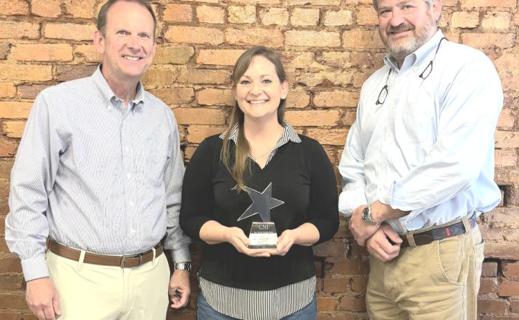 White County News general manager and marketing specialist Erin Etris, center, received the Tom Tucker All-Star award for 2025 on June 3. Regional Publisher Keith Barlow is at left, and CNI Chairman Alan NeSmith is at right. CARLY HENDERSON/WCN