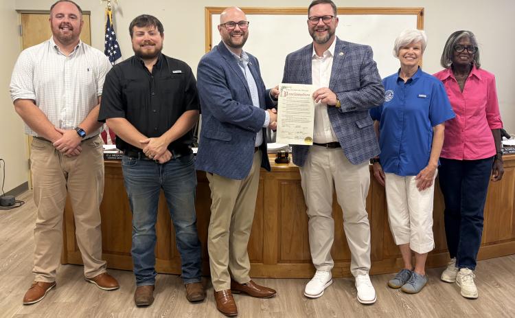 Members of the Cleveland City Council present a proclamation recognizing the 80th anniversary of Truett McConnell University to TMU President Dr. Larry Lyon during the council's July 20 meeting. The proclamation honored the university's eight decades of service to the community. CARLY HENDERSON/WCN