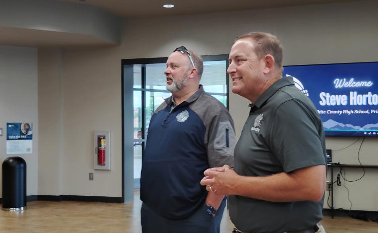 WCHS principal Steve Horton, left, and superintendent Dr. Jonathan Stribling welcome visitors during a recent meet and greet for Horton.  DENISE  ETHERIDGE/WCN