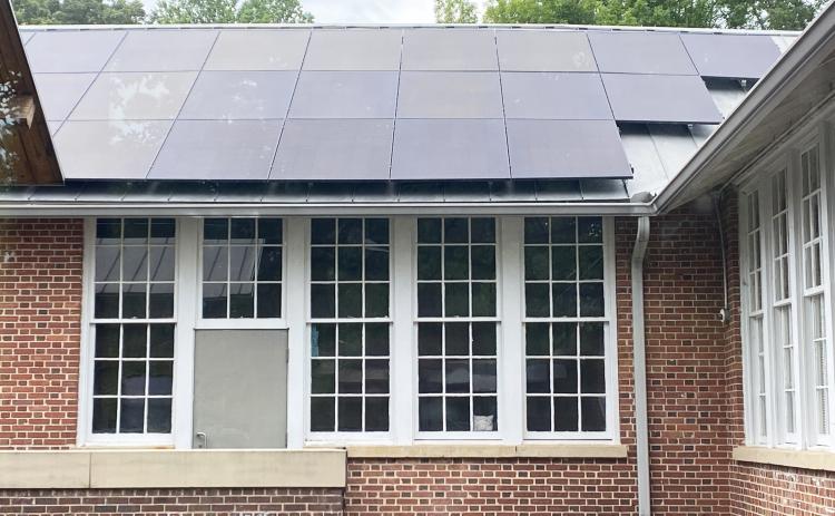 Thirty roof-mounted solar panels were installed at the Sautee Nacoochee Center as part of a new solar energy system that also includes a 40-panel ground array. The installation is expected to save the center nearly $500,000 in energy costs over the panels’ 30-year lifespan. SUBMITTED PHOTO