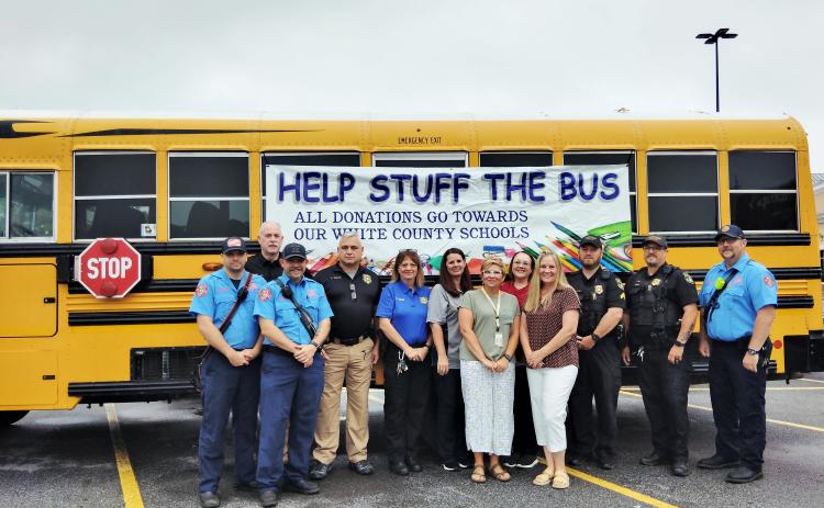 The annual Stuff the Bus school supply drive kicked off on Tuesday. From left: Cleveland Firefighter Trace Swoszowski, Cleveland Police Chief Jeff Shoemaker, Cleveland Firefighter Tim Nunnally, Deputy Chief Aaron Weiland, Capt. Donna Sims, school bus driver and trainer April Burdette, Student Support Coordinator Amanda Lammers, CPD administrative assistant Sheena Wright, School Transportation Director Sharon Hipps, Corp. Brandon Wood, Officer Perry Cook and Lt. Jared Joiner. DENISE ETHERIDGE/WCN