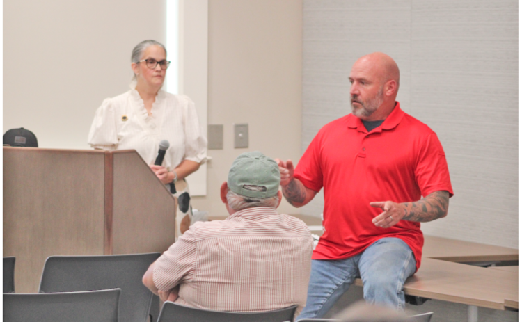Matthew Cook said he didn’t disagree with the Lumpkin County Sheriff’s remarks about the efficacy of the Flock camera system. “It’s a great tool, and he told you about the policies for how it’s supposed to be used. The problem is, ‘supposed to’ doesn’t always work,” Cook said, as townhall host Anita Anderson Spangler looked on. KEITH MURDEN/CNI