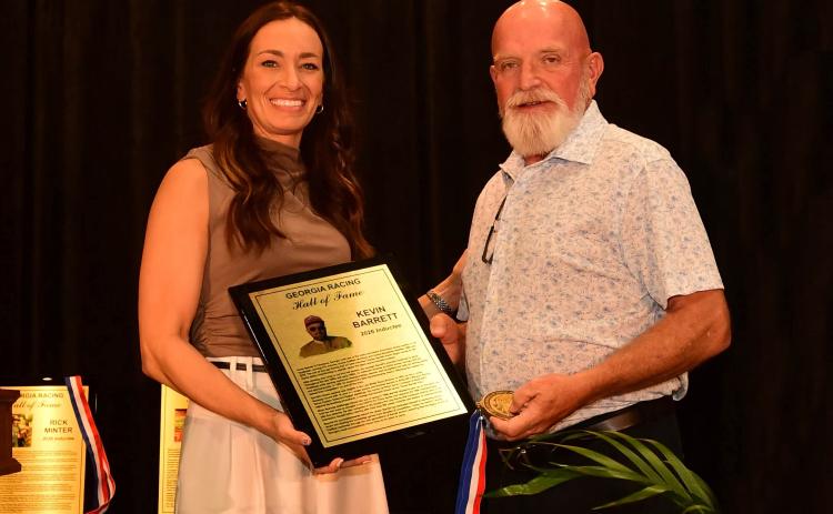 Kevin Barrett receives his Hall of Fame plaque during the ceremony. GEORGIA RACING HALL OF FAME/SPECIAL