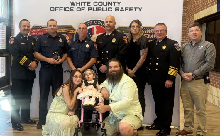 Pictured with Hanna and Patrick Day and daughter Aurelia are, from left, public safety personnel Josh Taylor, Trace Swoszowski, Terry Stewart, Jody Holland, Jessica Wood, Don Strength and Jonathan Jones with GEMA. See more photos on page 6A. SUBMITTED PHOTO