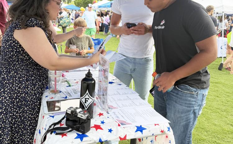 Shannon LaCava speaks with White County voters about candidates from both parties running in the upcoming elections. SUBMITTED PHOTO