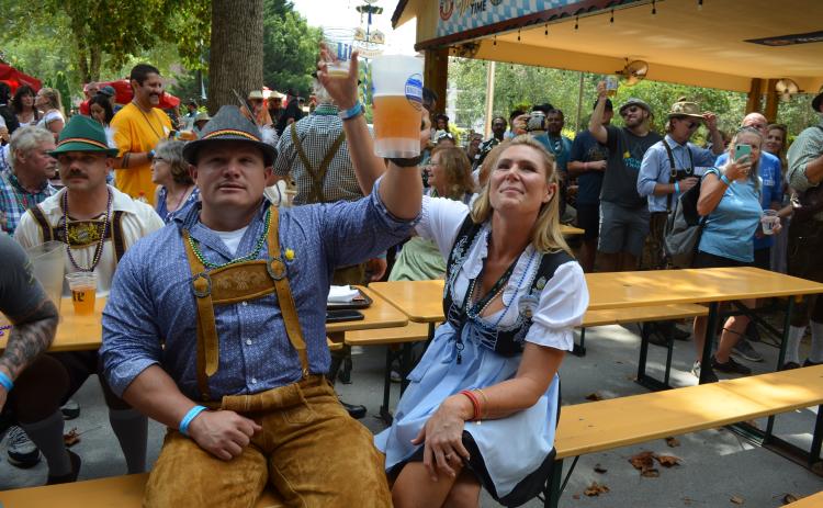Revelers enjoy a toast during Helen's annual Oktoberfest. FILE PHOTO