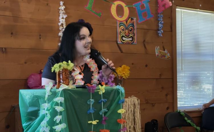 Executive Director Carly Bird welcomed people to the White County Peer Support Wellness and Respite Center’s 15th anniversary celebration. The luau included barbecue and sides, games, tours of the Center, karaoke and treats from the Kona ice truck. ERBELE/WCN