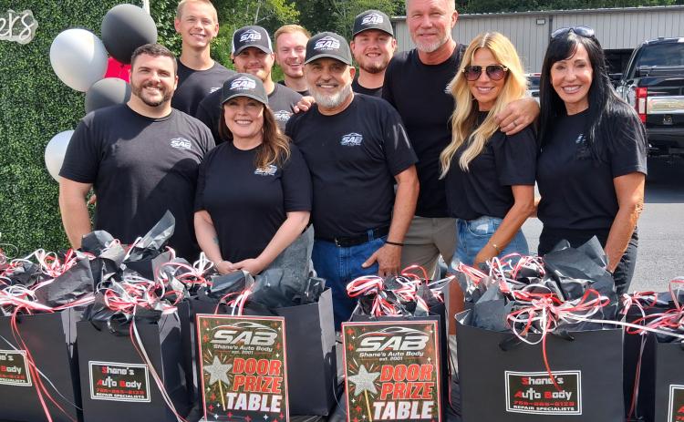 Pictured from left to right are Shane’s Auto Body employees Blake Slaton, Harrison Harper, Stacy Mitchell, Preston McGatha, Cash Laws, Mike Baker, Reese Alexander, Owner Shane Palmer, his wife Farrah Palmer and Office Manager Tina Blackburn. Not pictured are Howard England, Don Lepkoske, Mason Palmer, and Barrett Palmer. PHOTOS BY ERIN ETRIS