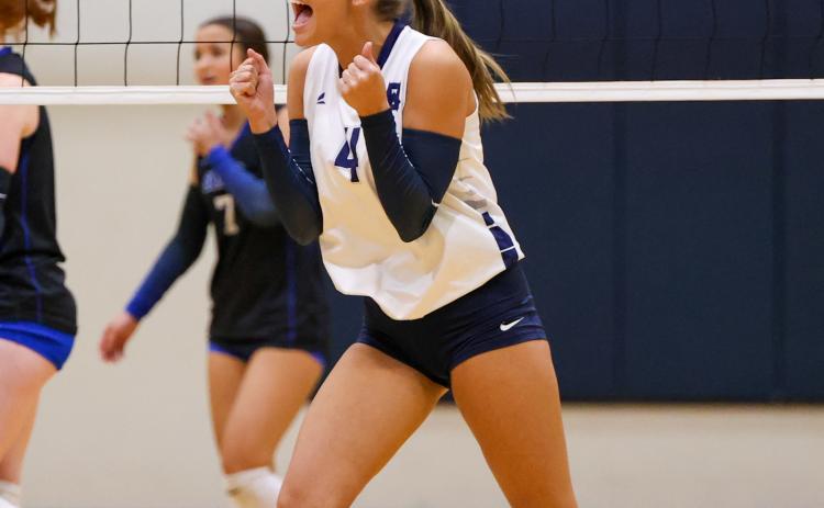 Kerrigan Cain celebrates after a point during the Lady Warriors' win over Banks County last week in Cleveland. JENNIFER KNIGHT/SPECIAL