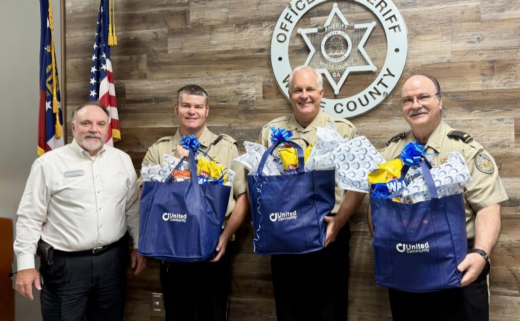 From left: United Community Bank President Donald Harris, Deputy Josh Fredrick, Sheriff Rick Kelley and Lt. Tim Chapman. SUBMITTED PHOTOS